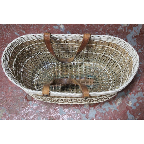 552 - A vintage plastic and rattan weaved shopping basket.