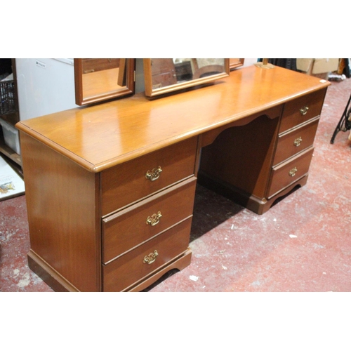 560 - A vintage Stag dressing table and mirror.