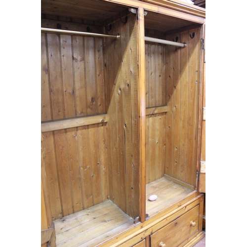 579 - A stunning large pine two door wardrobe and drawer base.