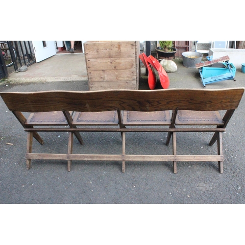 583 - A vintage folding bench of 4 folding seats.