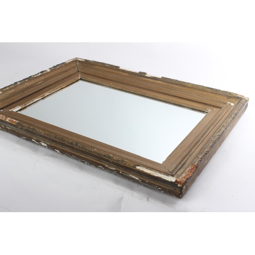 588 - An antique gilt framed mirror (a/f).