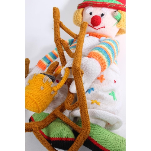 613 - A handknitted clown.