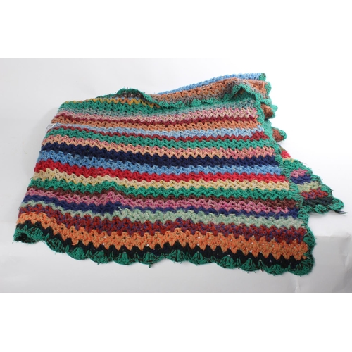 616 - A vintage hand crocheted patterned blanket.