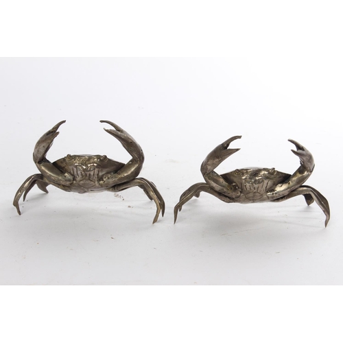 628 - A pair of white metal ornamental crabs.