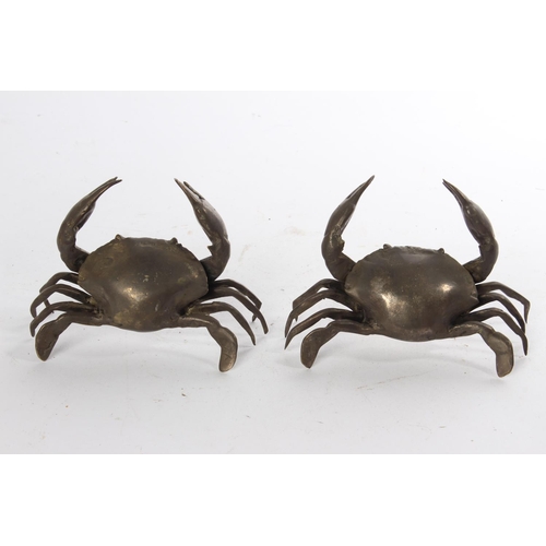 628 - A pair of white metal ornamental crabs.