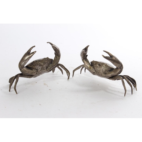 628 - A pair of white metal ornamental crabs.