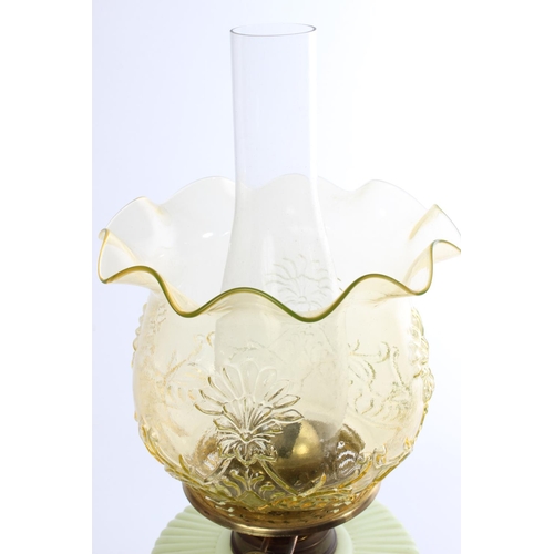 641 - A stunning antique uranium glass oil lamp and an amber glass shade.