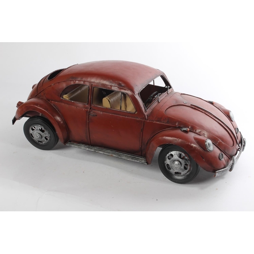 646 - A large metal 'Beetle' car, measuring 20