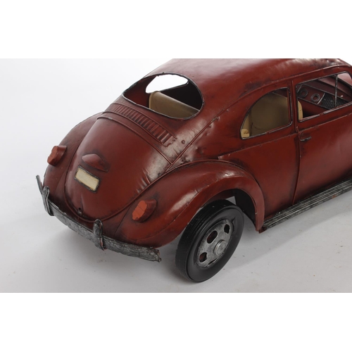 646 - A large metal 'Beetle' car, measuring 20