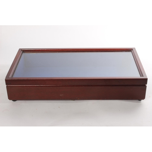 651 - A small table top display box, measuring 41cm x 22cm x 8.5cm.