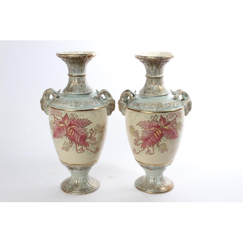 656 - A pair of Antique ceramic vases with rams head mounts (a/f).