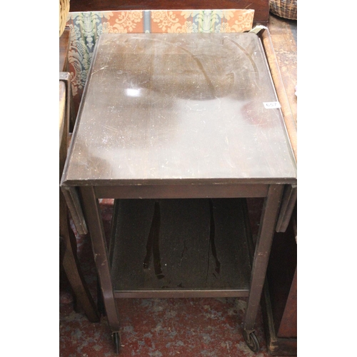 657 - A vintage drop leaf table with undershelf.