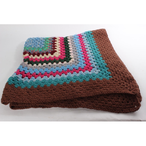 659 - A vintage crocheted wool blanket.