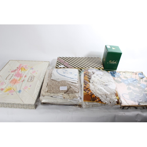 660 - A vintage boxed set of Irish linen, a boxed Old Mill hand printed 'Roses' table cloth and lots more,... 