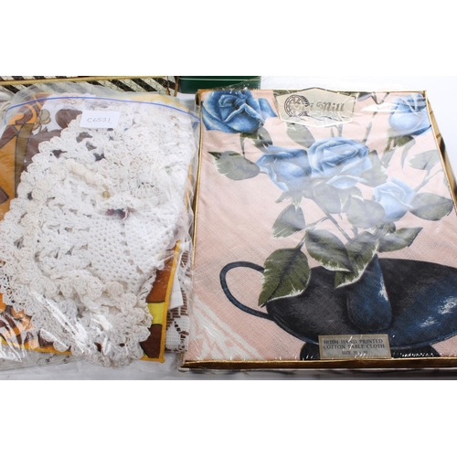 660 - A vintage boxed set of Irish linen, a boxed Old Mill hand printed 'Roses' table cloth and lots more,... 