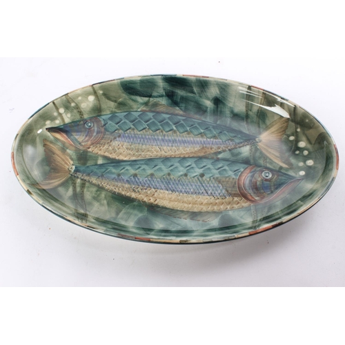 668 - A stunning Jersey pottery dish decorated with fish, measuring 37cm.