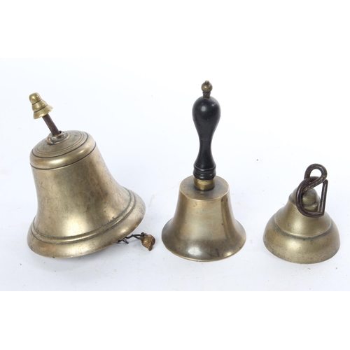 671 - Three antique brass bells.