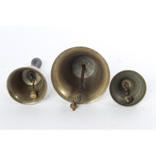 671 - Three antique brass bells.