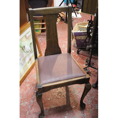 677 - A vintage mahogany drop leaf dining room table and a set of four leather upholstered chairs.