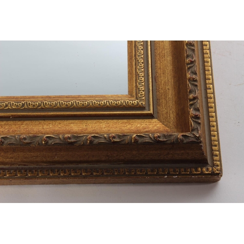 687 - A small gilt framed wall mirror.