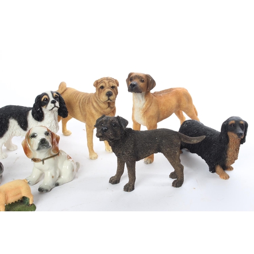 694 - A large collection of dog ornaments and more.