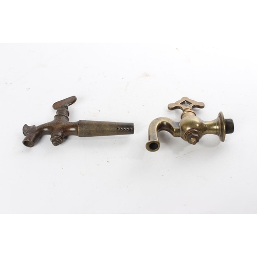 696 - Two Antique brass spigots/ keg taps.