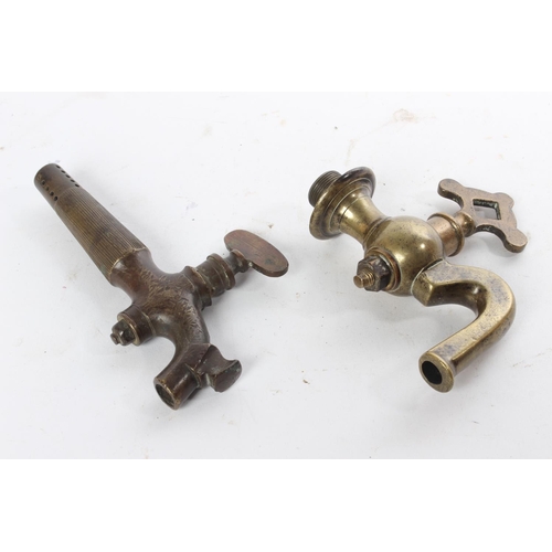 696 - Two Antique brass spigots/ keg taps.