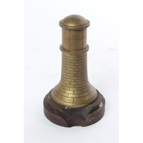 699 - An unusual brass novelty lighter in the style of a lighthouse.