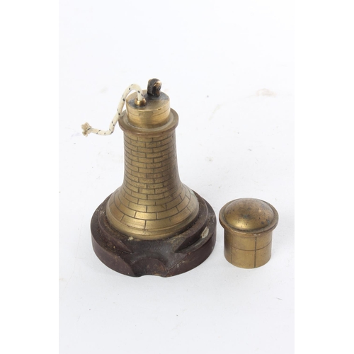 699 - An unusual brass novelty lighter in the style of a lighthouse.