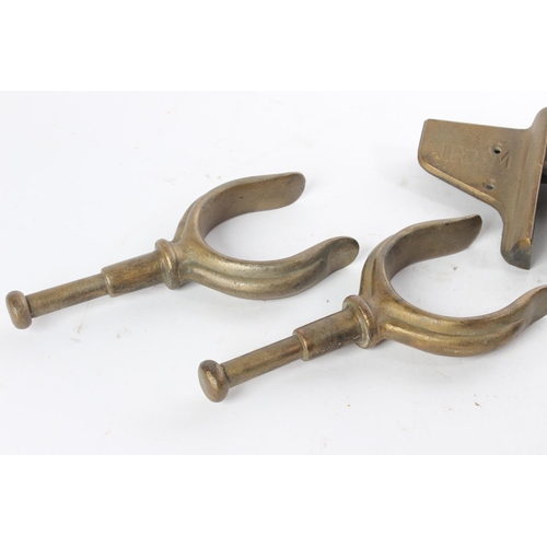 702 - A stunning pair of antique bronze rowlocks, each stamped R.T.M. 1900.