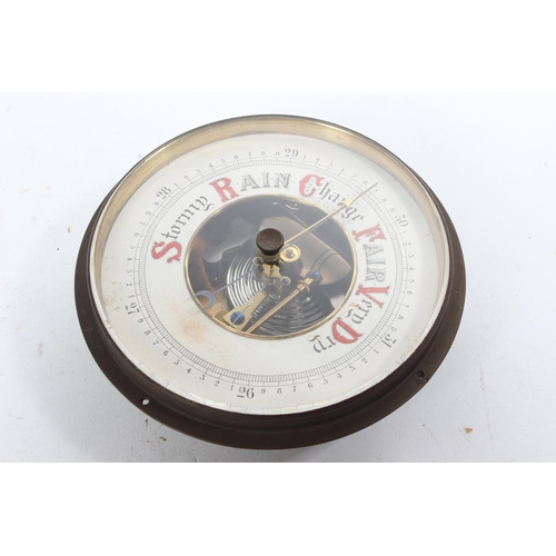 710 - A vintage brass cased barometer made in Germany.