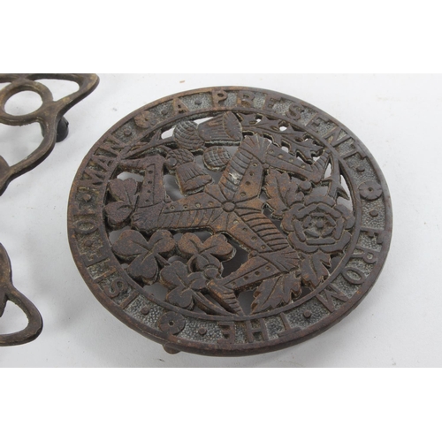 711 - An Isle of Man souvenir trivet, inscribed G W D Rd 168240 and two others.