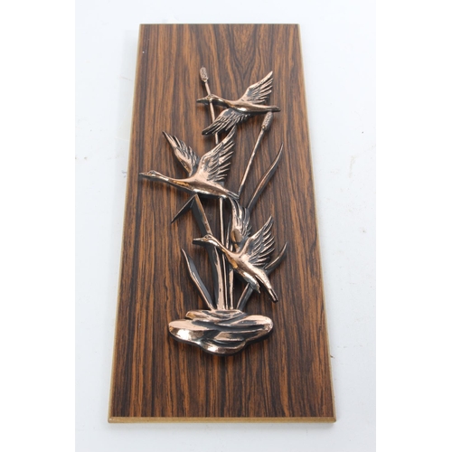 715 - A vintage copper wall plaque of ducks.