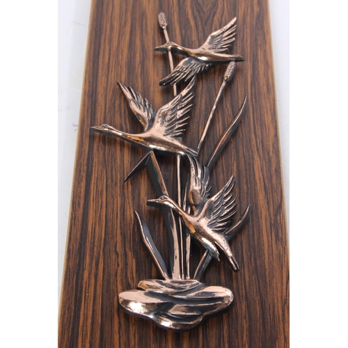 715 - A vintage copper wall plaque of ducks.