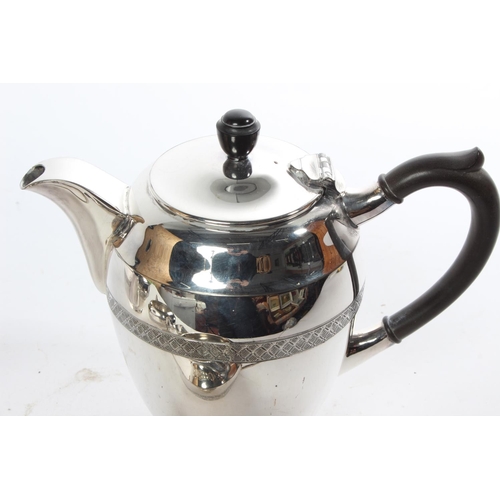 719 - A four piece Walker & Hall silver plated tea service.