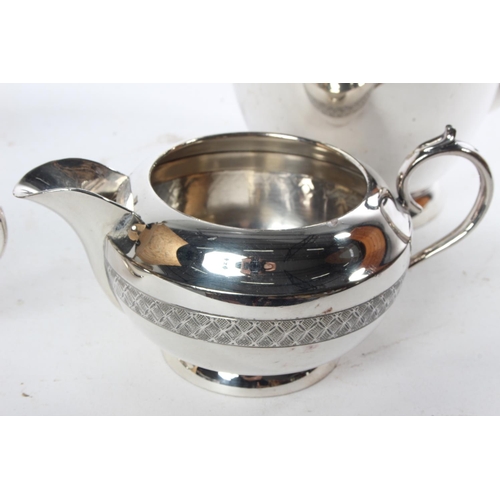 719 - A four piece Walker & Hall silver plated tea service.