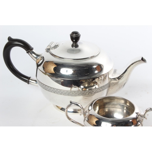 719 - A four piece Walker & Hall silver plated tea service.