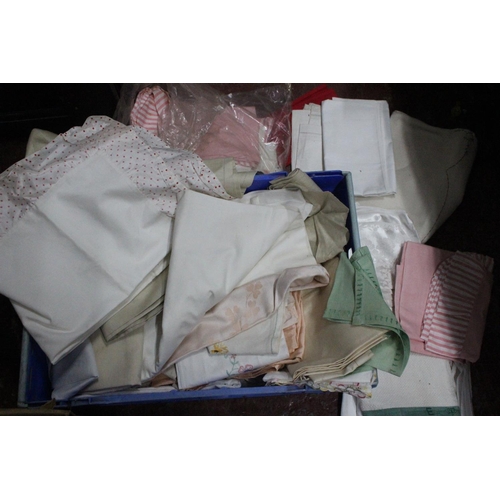 723 - A large lot of Irish linen to include transfer printed table cloths, pillow cases, fabric and more.