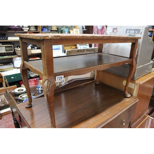 729 - A vintage coffee table with piecrust edge and undershelf.