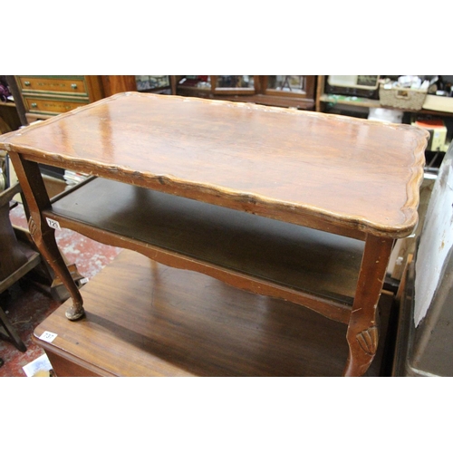 729 - A vintage coffee table with piecrust edge and undershelf.