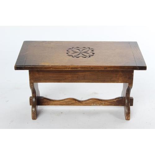 732 - A vintage oak musical jewellery box in the style of a table.