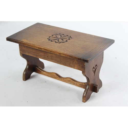 732 - A vintage oak musical jewellery box in the style of a table.