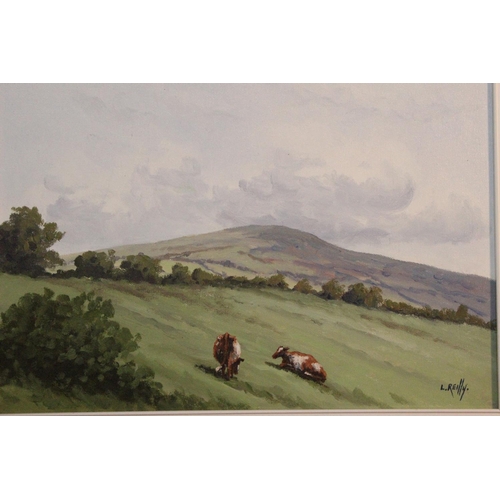 741 - A gilt framed oil painting 'Cattle Grazing' signed Liam Reilly.