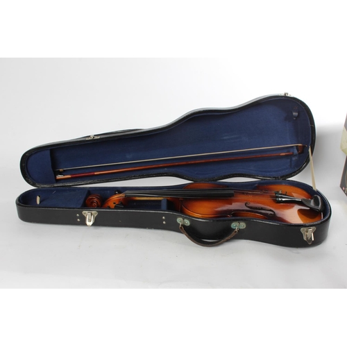 748 - A cased 'Blessing' violin.