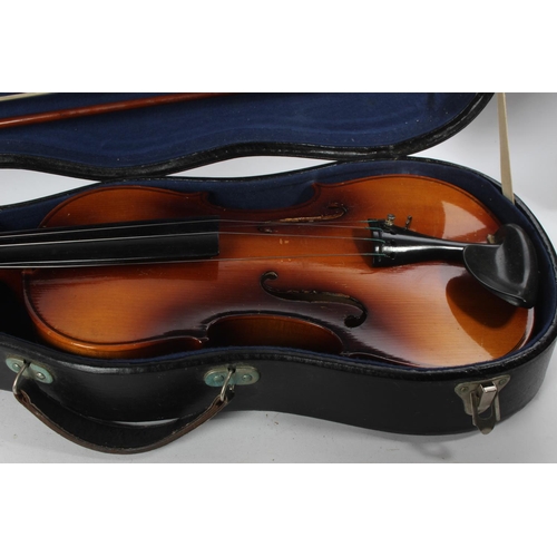 748 - A cased 'Blessing' violin.