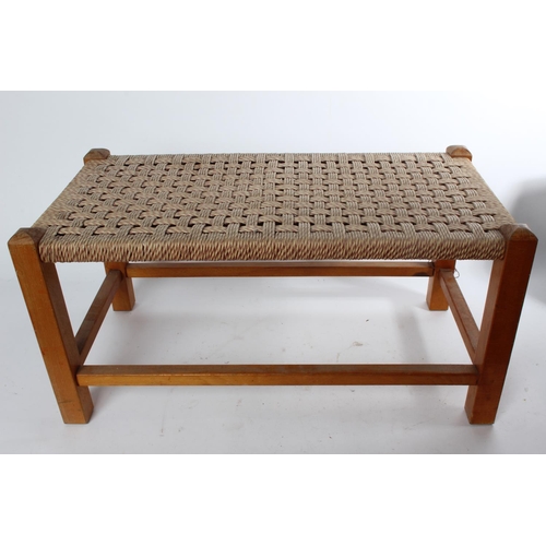 749 - A vintage weaved top long stool.