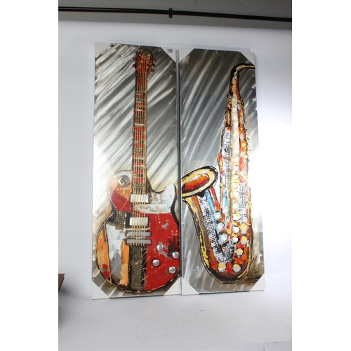 752 - A large unframed picture of a saxophone and another of a guitar, measuring 40cm x 120cm.