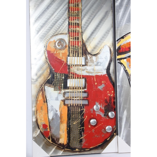 752 - A large unframed picture of a saxophone and another of a guitar, measuring 40cm x 120cm.