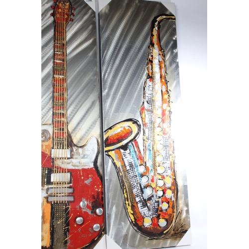 752 - A large unframed picture of a saxophone and another of a guitar, measuring 40cm x 120cm.