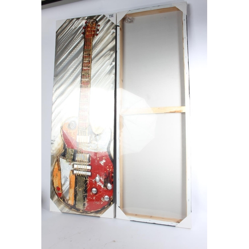 752 - A large unframed picture of a saxophone and another of a guitar, measuring 40cm x 120cm.